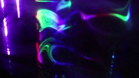 Laser rays lighting through the clouds of smoke. Smoke and laser rays. Stock Footage 69737839