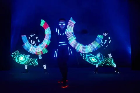 Laser show performance, dancers in led suits with LED lamp, very beautiful .. Fotos Stock