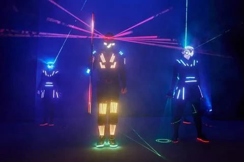 Laser show performance, dancers in led suits with LED lamp, very beautiful .. Fotos Stock