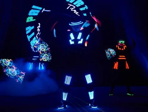 Laser show performance, dancers in led suits with LED lamp, very beautiful .. Fotos Stock
