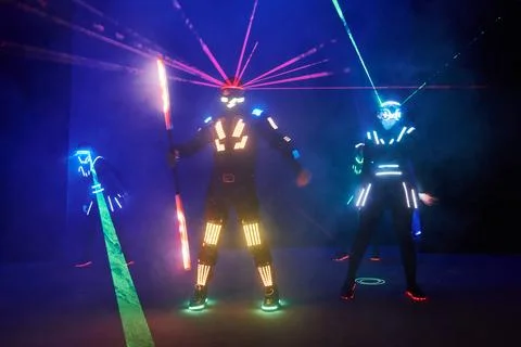 Laser show performance, dancers in led suits with LED lamp, very beautiful .. Fotos Stock