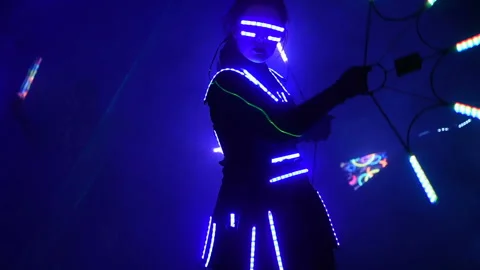 Laser show performance, dancers in suits with LED lamp, very beautiful night Stock Footage 98631364