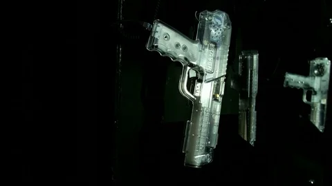 Laser tag weapons on wall Stock Footage 77355443