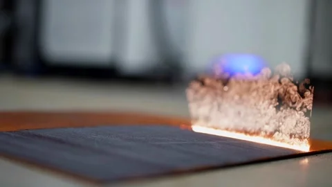 Laser technology is used to remove rust from metal parts, the beam precisely Stock Footage 281082688