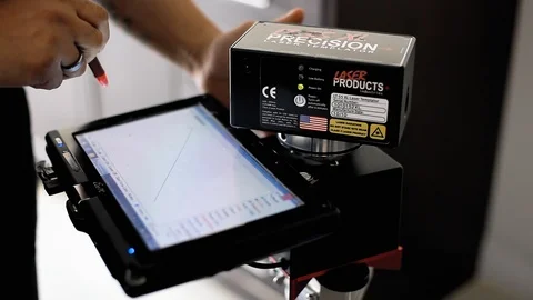 A laser templator measuring the surface of a high-end granite countertop Stock Footage 104754862