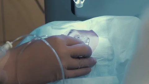 Laser vision correction. A patient in the operating room during ophthalmic Stock Footage 102829151