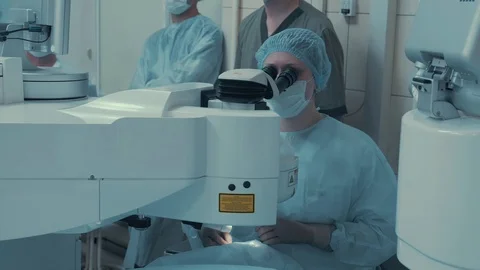 Laser vision correction. Surgeon in the operating room during ophthalmic surgery Stock Footage 102828550