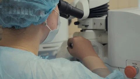 Laser vision correction. Surgeon in the operating room during ophthalmic surgery Stock Footage 102828939