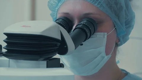Laser vision correction. Surgeon in the operating room during ophthalmic surgery Stock Footage 102829212