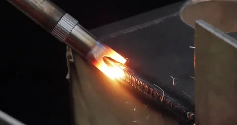 Laser welding machine with hand hold gun. Laser welding is shown in close-up. Stock Footage 238983491