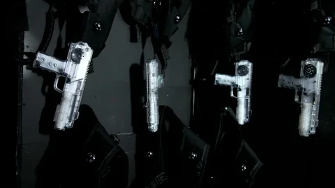 Lasertag guns hang on the wall Stock Footage 77355582