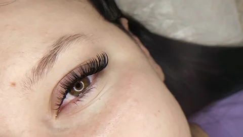 Lash extensions in beauty salon macro eye Stock Footage 161025790