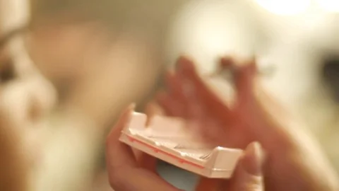 Lash maker increases eyelashes, make up artist making long lashes, woman in Stock Footage 75069094