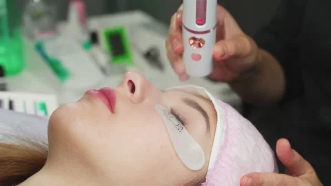 Lash Maker uses a nebulizer to finish during the procedure. 4k Stock Footage 140712655
