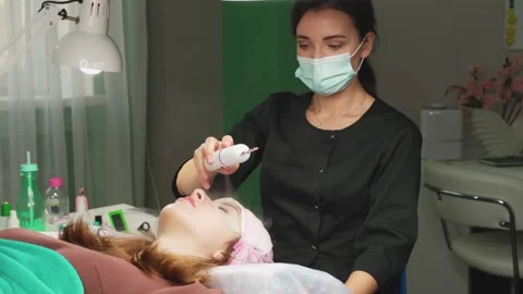 Lash Maker uses a nebulizer to finish during the procedure. 4k Stock Footage 140712736