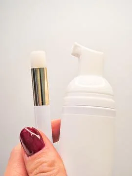 Lash shampoo bottle and applicator with elegant design for beauty routine Stock Photos