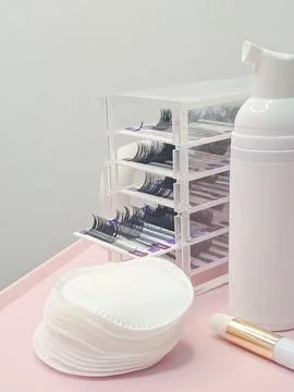 Lash shampoo concept with beauty tools and accessories on pink background Stock Photos