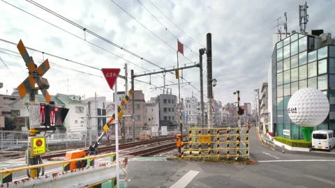 Last and unique level crossing of Yamanote line called Nakazato railroad Stock Footage 165823088