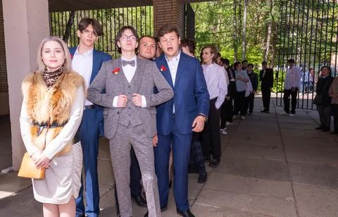 Last call at school. elegant high school students on the solemn line. Stock Photos