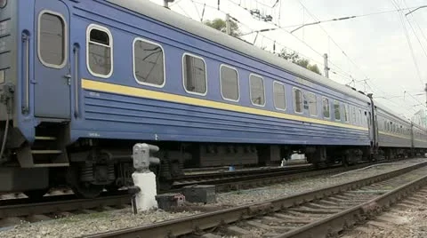 The last car of an old train leaves Stock Footage