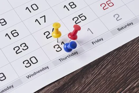 Last chance concept with colored push pins on monthly calendar Stock Photos