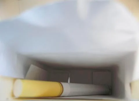 Last cigarette in the flip box. stop the nicotine Stock Photos