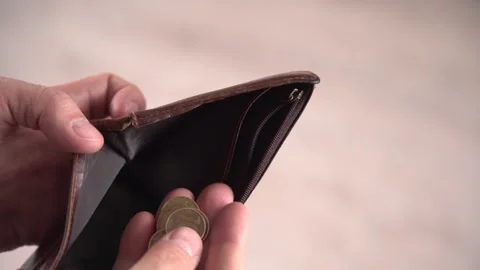 The last coins in an empty wallet are a symbol of inflation Stock Footage 304779402