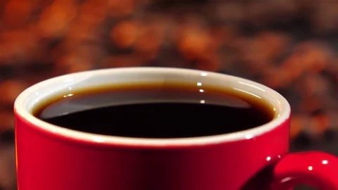 Last drop of coffee falls into the drink. Slow motion Stock Footage