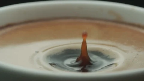Last drop of coffee falls into the filled Cup from the coffee machine in slow Stock-Footage 88741029