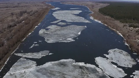 Last large ice floes on a river in spring. Aerial drone view Stock Footage 124978130