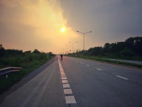 Last light on the road. Stock Photos