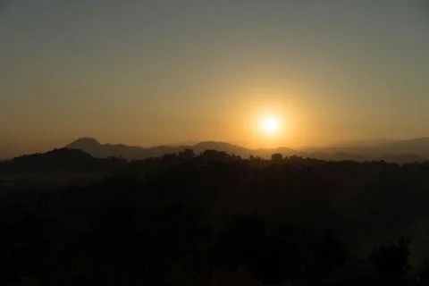 Last light of the sun is falling on the mountain in the evening. Stock Photos