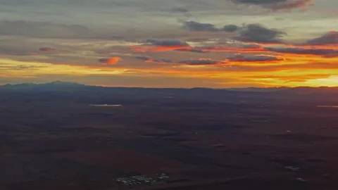 Last Light Sunset Above Distant Horizon from Airplane Window Stock Footage 337950039