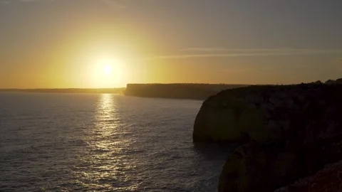 Last light from sunset over ocean with panoramic view from cliffs Stock Footage 273674016