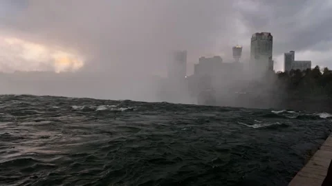 Last light: The waters of Niagara River flow rapidly towards Falls Stock Footage 141474066