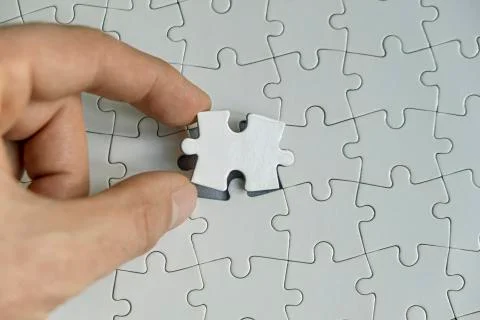 Last piece of puzzle Stock Photos
