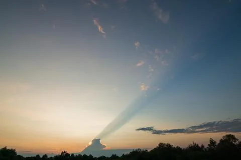 The last ray in the evening sky. 写真素材