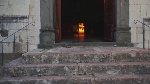 The last ray of light before the sunset in the small catholic church, 4K Stock Footage 72028426