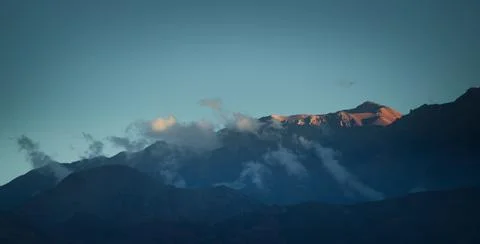 The last rays of sun lighting the Andes Mountains near Uspallata, province of Stock Photos