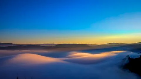 Last rays of sun over the clouds Stock Photos