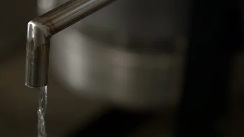 Last step of a Distillery Where Final Product of Alcohol comes out of Spigot Stock Footage 125110467