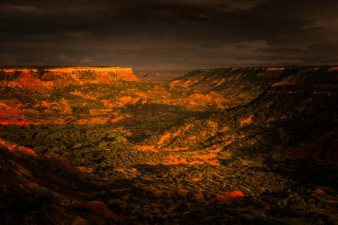 The last sun rays of the day hitting the Palo Duro Canyon Stock Photos