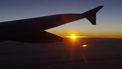 The last sunlight during a flight Stock Footage 268421443