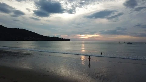 The last swim on a beach at sunset Stock Footage 88162301