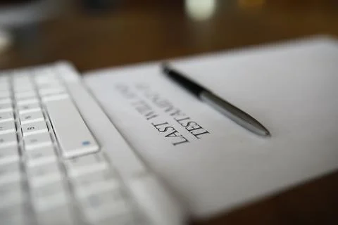 Last Will and Testament Document with Pen near Keyboard on Wooden Desk Stock Photos