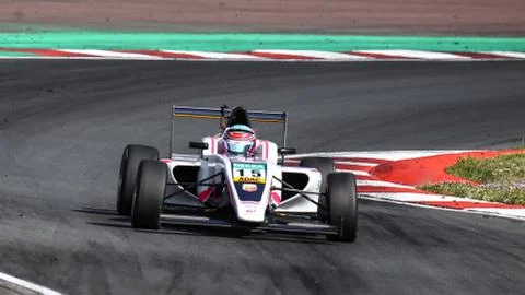 Laszlo Toth driving a white R-ace GP single-seater car Stock Photos