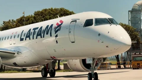 Latam studies operating its new Embraers in South America after incorporating th Stock Footage 347300975