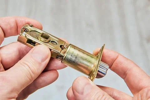 Latch bolt hardware,  exhibits extendable bolt, metal housing, and fixing p.. Fotos de archivo