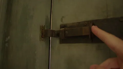 Latching an old prison cell in former concentration camp, now a museum Stock Footage 299041165
