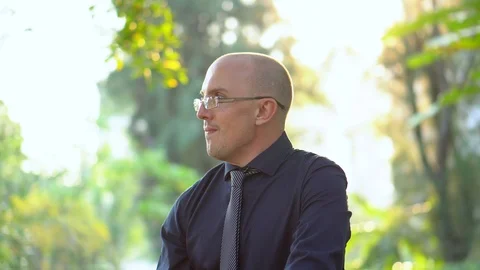 Late 20s Office Worker Drinking Healthy Smoothie in Park Video stock 102358592